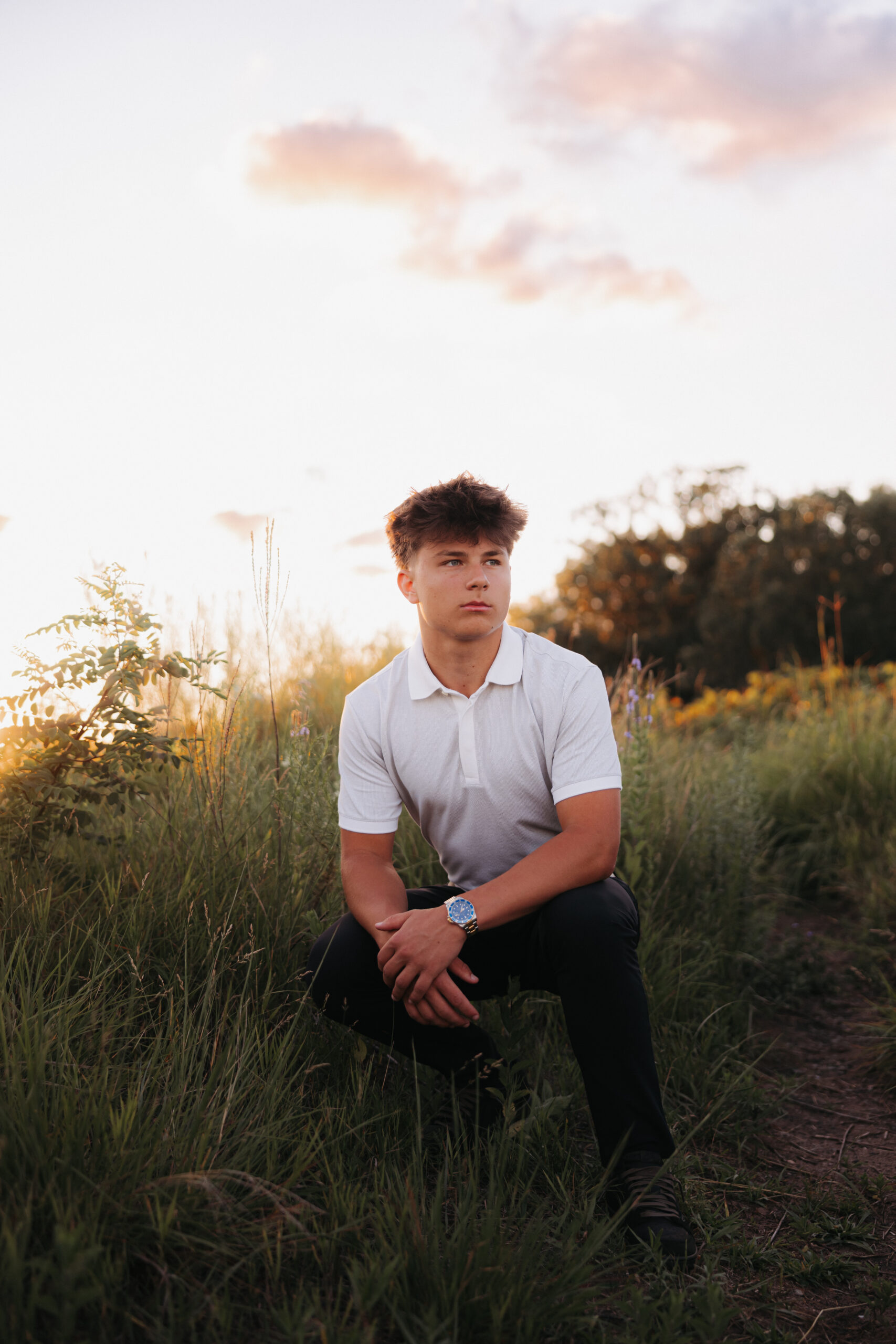 Class of 2026 senior photos of East Ridge athlete Connor Halvorson, with golden hour views, a proud family legacy, and deep community roots.